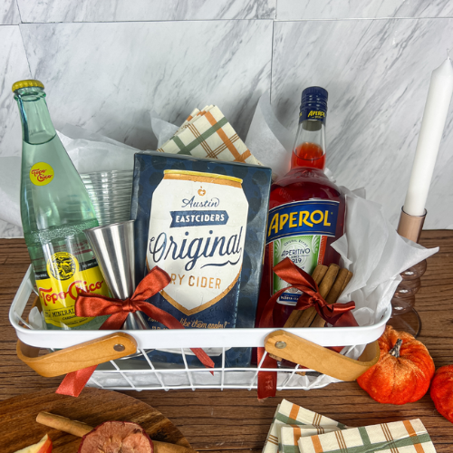 Apple Cider Aperol Spritz cocktail with cinnamon garnish
